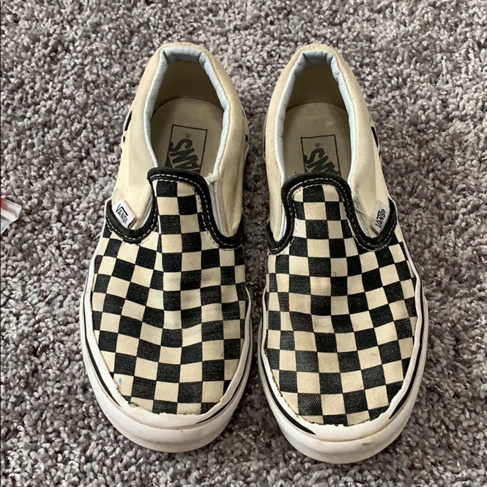 Size 1 Vans black and cream checker slip ons.